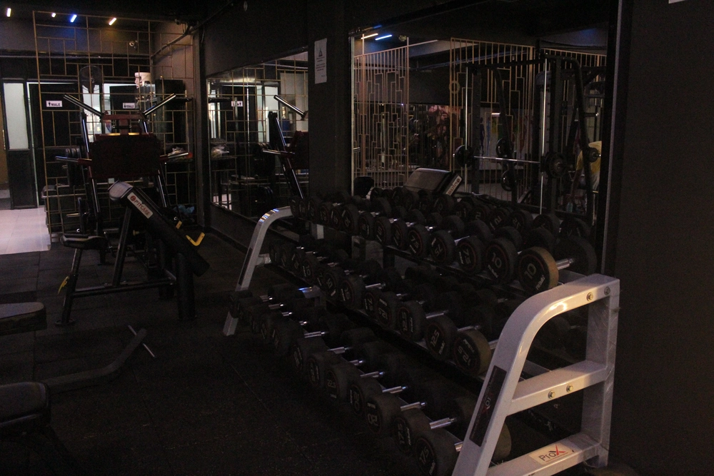 Free weights and strength training area at our premium fitness center in Sector J